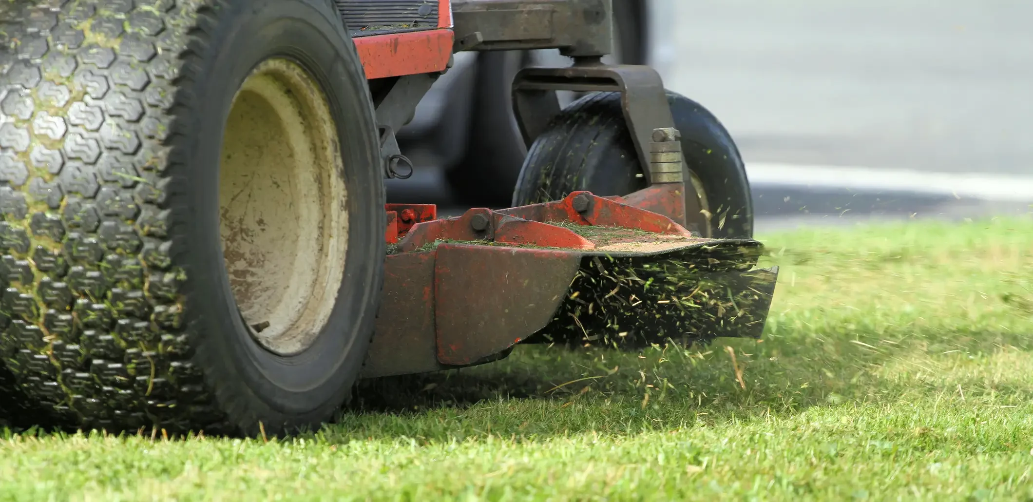 An up close view of a turf wheel system equipped to a lawn mower - WSD Wheel Systems
